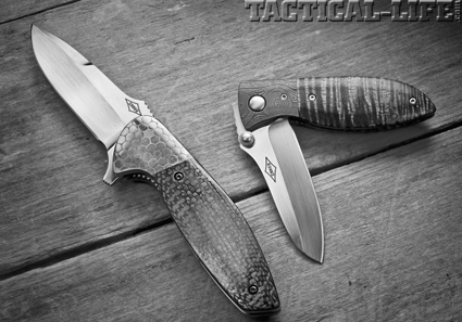 A pair of dressed-up Carey folders, both in carbon fiber handles and Chad Nichols Damascus. At top is a Nitro Flipper done up in Nichols’ Lizard pattern; at bottom a Tremor in his Whoops pattern.