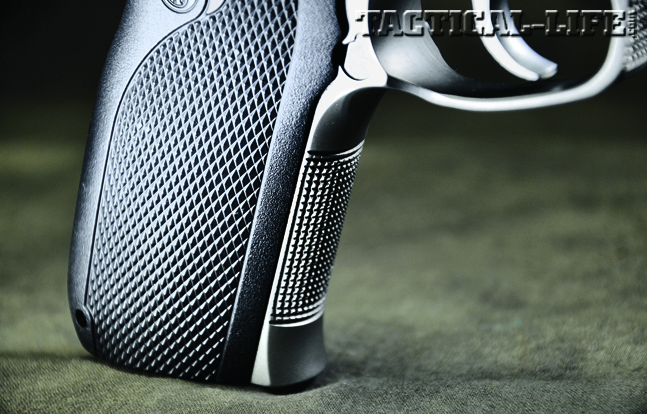 The S&W 1076 features checkering on the grip panels as well as the fronstrap to give FBI agents better control.