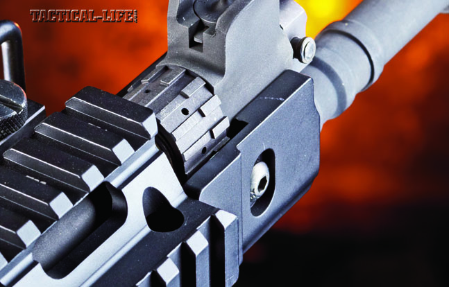 The front sight is pure FAL. Integral to the gas block, the front sight is adjustable for elevation and has large protective wings. Behind it is the gas regulator sleeve, allowing users to tune the carbine for conditions or ammo.