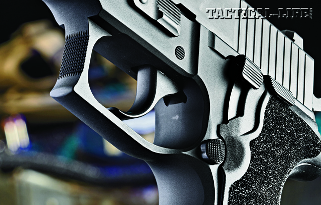 The trigger features a long, smooth double-action pull and a lighter single-action pull. Note the checkered front portion of the triggerguard.