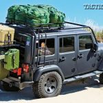 A 2012 four-door Jeep Wrangler JK Sahara with a 3.6-liter Pentastar V6 engine, tricked-out for tactical operations, hits the beach fully loaded and prepared for the worst.