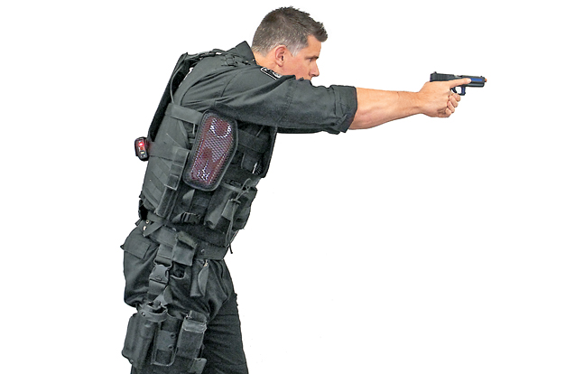 Officers work together in close quarters wearing Setcan’s entire force-on-force laser training system, including the StressVest with side panels, the StressX Training Belt and laser pistols.
