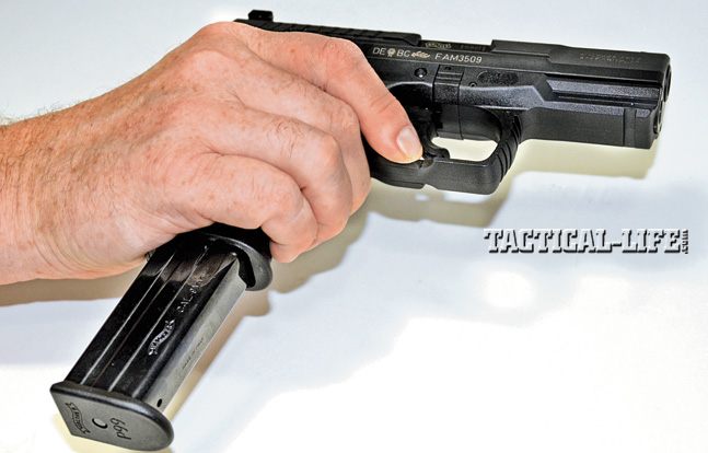 The ambidextrous magazine release runs along the bottom of the triggerguard. Users can learn to activate it quickly with their trigger fingers.