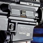 The Operator III features a forged upper receiver for strength and durability. Note the shell deflector and hinged dust cover door.