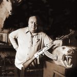 Colonel Rex Applegate on page 7 of his book The Close-Combat Files of Col. Rex Applegate poses in his trophy room with one of his other legendary rifles.