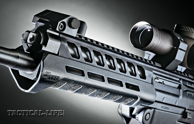 The standard SIG556xi handguard is made of polymer, has several cooling vents and can accept Magpul MOE accessory rails.