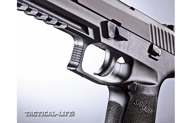 The P320 is available with a smooth-faced trigger (shown) or one with a trigger safety toggle. Either way, it will pass a drop test.