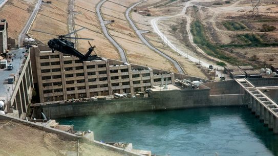 A helicopter oversees the Haditha Dam, which provides electricity to a third of Iraq.
