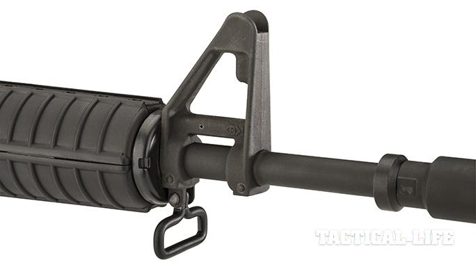 The XM177E2 sports an A1-style front sight post with a sling loop on the bo...