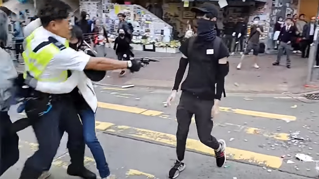 Hong Kong Police shot an unarmed protestor.
