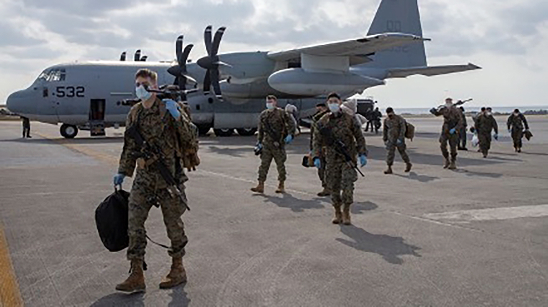 U.S. Marines with 1st Battalion, 25th Marine Regiment, arrive at Kadena Air Base, Okinawa, Japan, on Feb. 28, 2020. Upon their return from the Republic of Korea, the Marines were screened in accordance with U.S. Centers for Disease Control and Japanese government guidelines. III MEF is taking its responsibilities to protect our Marines, Sailors, families, and local communities safe by actively working to prevent the further spread of COVID-19. (U.S. Marine Corps photo by Lance Cpl Ujian Gosun)