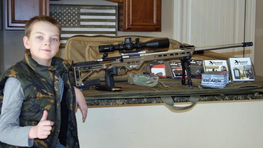 Warne and industry partners presented Paxton Spencer with a long-range shooting kit.