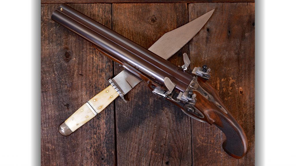 The Pedersoli has beautiful, browned barrels and color cased furniture. The three-quarter stock is European walnut with a hand checkered pistol grip and deeply fluted color cased steel butt cap.