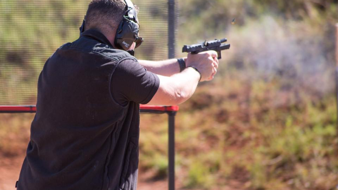 the author shooting one of his Beretta APX Centurions
