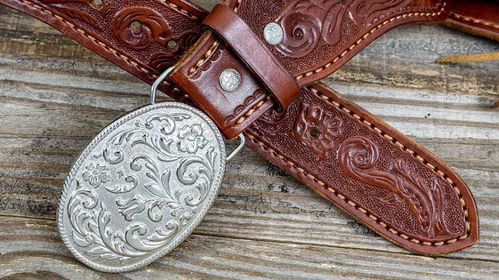 The “Jake” rig has a silver-color oval belt buckle cast in floral relief. The tongue of the wide belt, along with the buckle end, are tapered to a width of 1.75 inches.