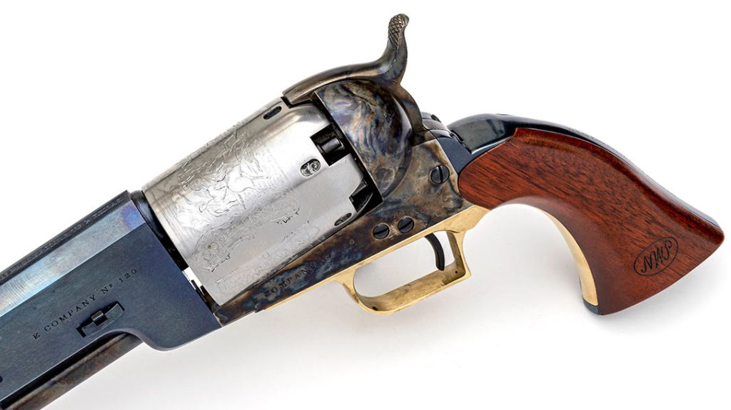 Both Walker Colt cylinders are left “in the white” and have the engraved “dragoon and Indian” scene. The walnut stocks have an inspector’s cartouche stamped on them.