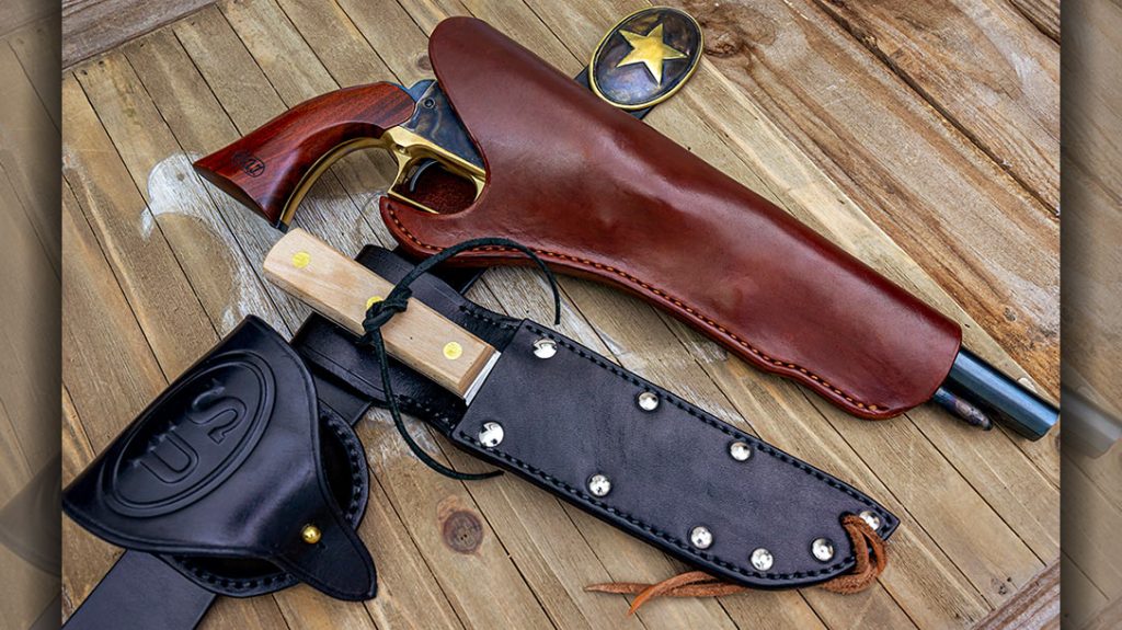 Shown is the “Gus McCrae” leather gear from Chisholm’s Trail Old West Leather. Included in the set are (left to right) a belt, cap box, knife with sheath, holster and authentic belt buckle.