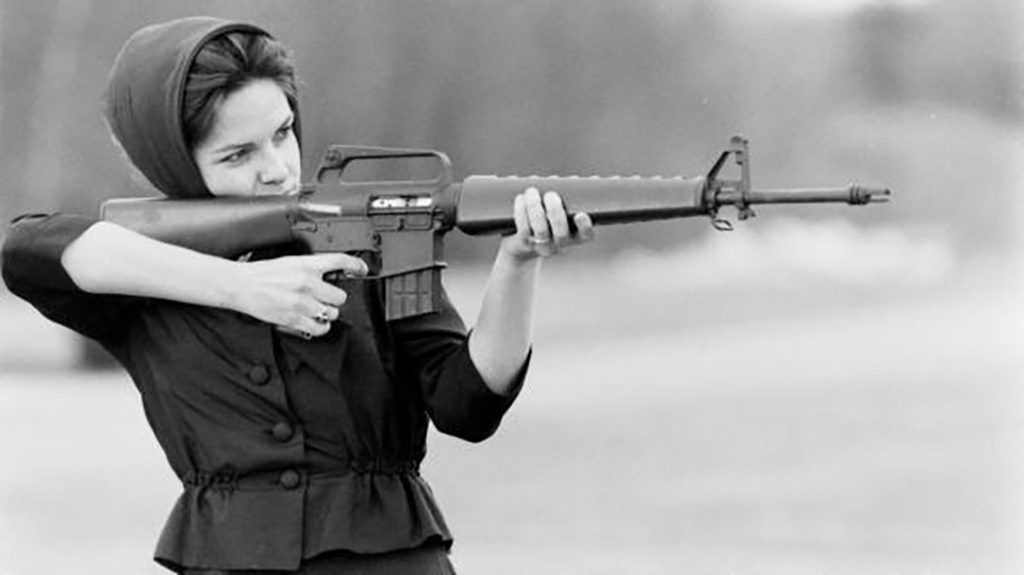 Miss America winner Maria Fletcher with an M16 in 1963.